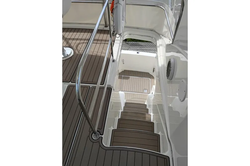 Slide: The Image of Staircase on 2005 Silverton 38 Convertible yacht with sleek wooden finish and metal railing. - 39