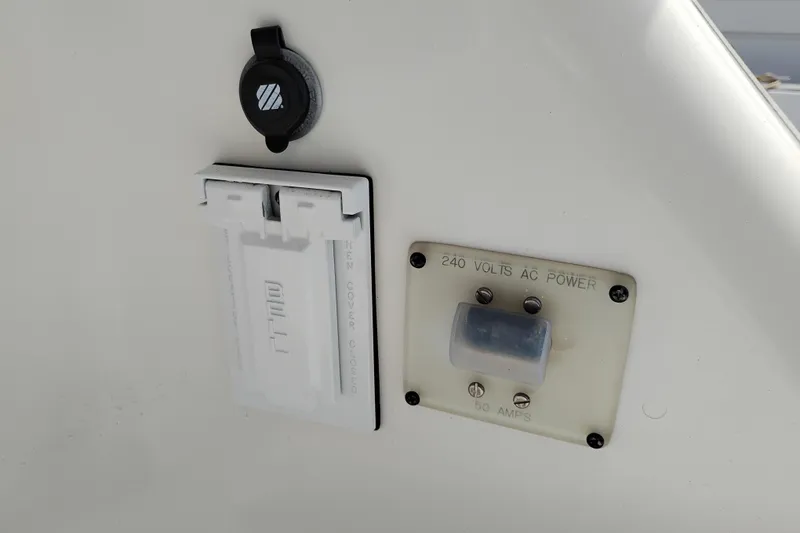 Slide: The Image of 240 volts AC power outlet on 2005 Silverton 38 Convertible boat. - 41