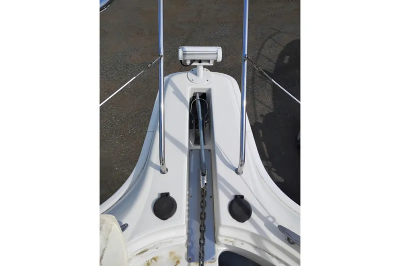 Slide: The Image of Bow of 2005 Silverton 38 Convertible boat with anchor chain and railing. - 45