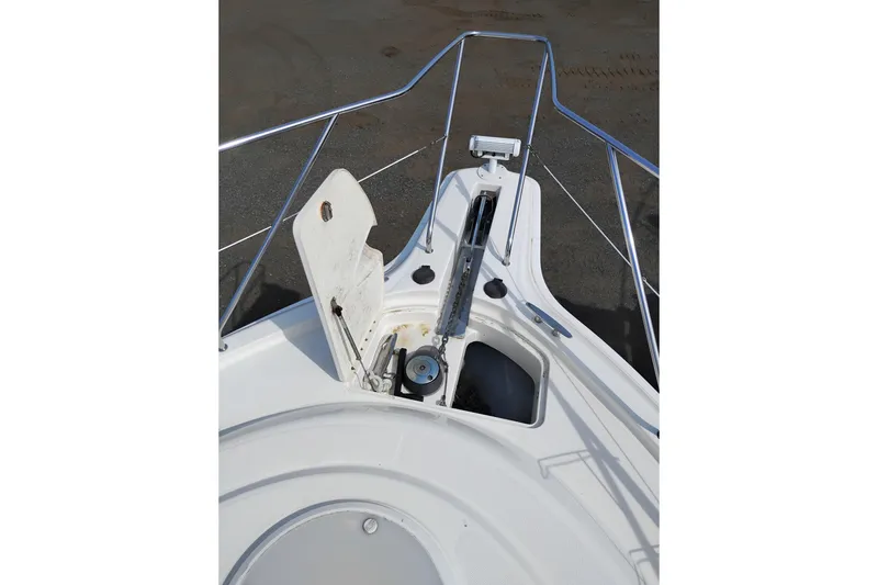 Slide: The Image of 2005 Silverton 38 Convertible boat anchor system with open hatch and railing. - 46
