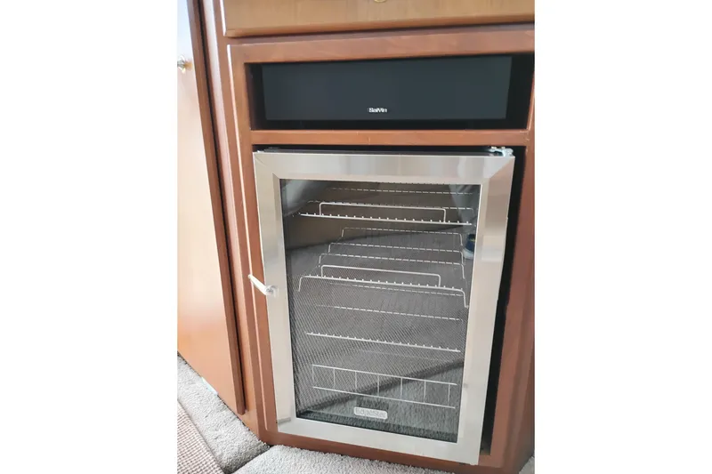 Slide: The Image of Stainless steel wine cooler in 2005 Silverton 38 Convertible yacht interior. - 53