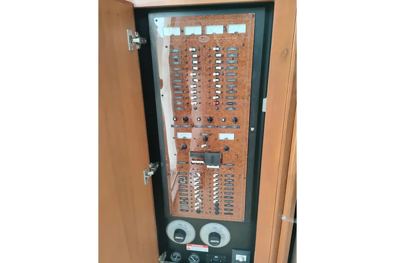 Slide: The Image of Electrical control panel on a 2005 Silverton 38 Convertible boat. - 54