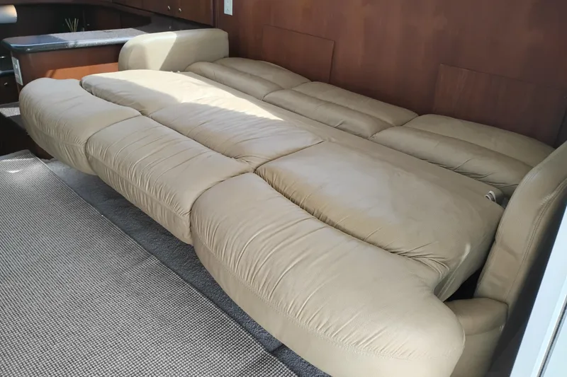 Slide: The Image of Beige leather sofa bed in 2005 Silverton 38 Convertible yacht interior. - 57