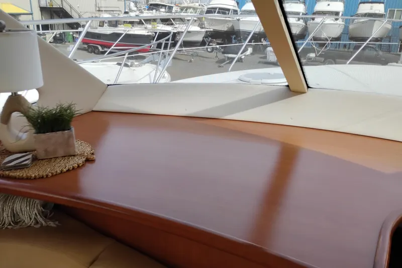Slide: The Image of Interior view of 2005 Silverton 38 Convertible yacht with wooden table and decor. - 58