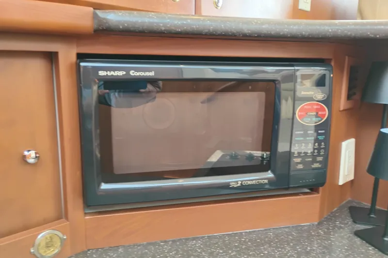 Slide: The Image of Sharp Carousel microwave in 2005 Silverton 38 Convertible yacht kitchen. - 64