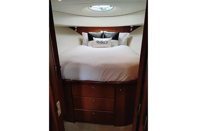 Slide: The Image of Luxurious bedroom interior of 2005 Silverton 38 Convertible yacht with plush bedding. - 68