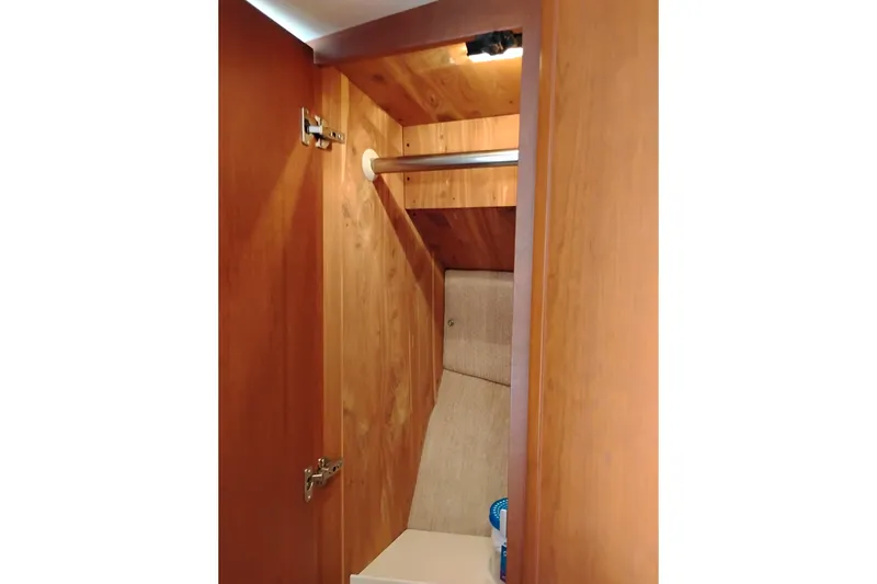 Slide: The Image of Wooden closet interior on a 2005 Silverton 38 Convertible yacht. - 72