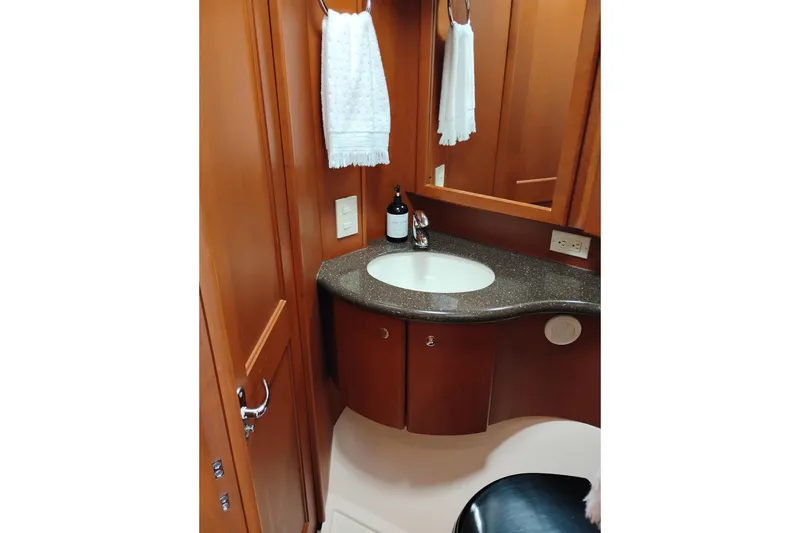 Slide: The Image of Luxurious bathroom in 2005 Silverton 38 Convertible yacht with wooden cabinetry. - 73