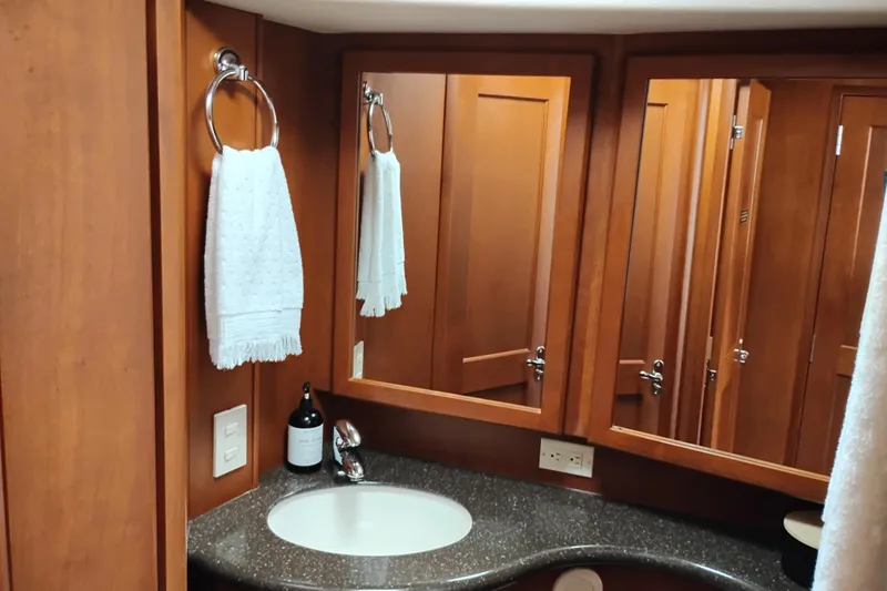 Slide: The Image of Luxurious bathroom interior of 2005 Silverton 38 Convertible yacht with wooden cabinetry. - 74