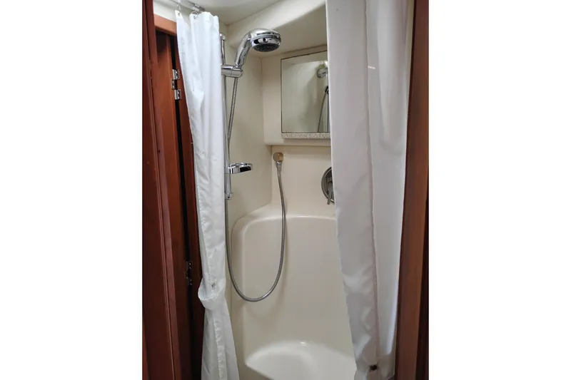 Slide: The Image of Shower area in 2005 Silverton 38 Convertible yacht with curtain and handheld showerhead. - 78