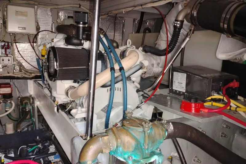 Slide: The Image of Engine room of a 2005 Silverton 38 Convertible boat, showcasing mechanical components. - 87