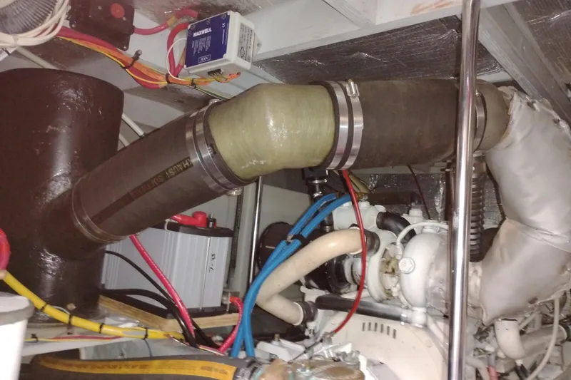Slide: The Image of Engine room of 2005 Silverton 38 Convertible with visible wiring and exhaust components. - 88