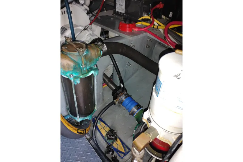 Slide: The Image of Engine compartment of a 2005 Silverton 38 Convertible boat, showing mechanical components. - 89