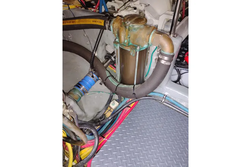 Slide: The Image of Engine compartment of a 2005 Silverton 38 Convertible with hoses and wiring. - 91