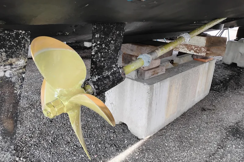 Slide: The Image of Propeller and shaft of a 2005 Silverton 38 Convertible boat on dry dock. - 97