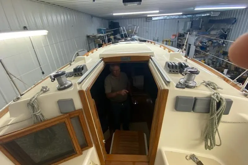 Slide: The Image of 1992 Tartan 31 Piper sailboat interior view in a storage facility. - 2
