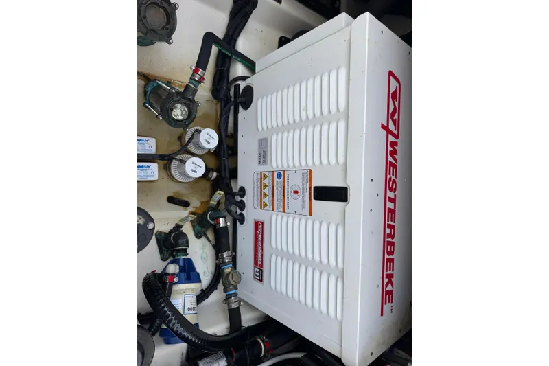 Slide: The Image of Engine compartment of 2021 Boston Whaler 380 Outrage with Westerbeke generator. - 19