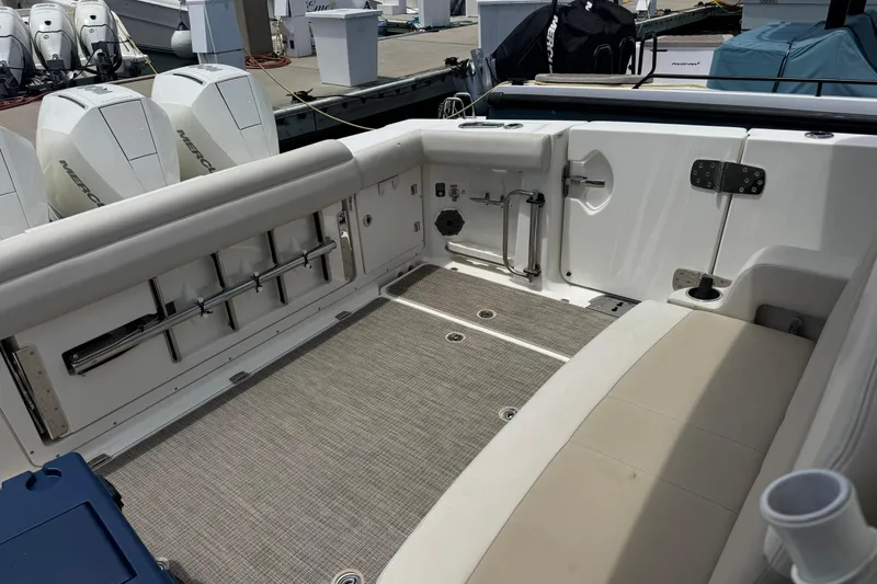 Slide: The Image of 2021 Boston Whaler 380 Outrage boat interior with seating and Mercury engines. - 5
