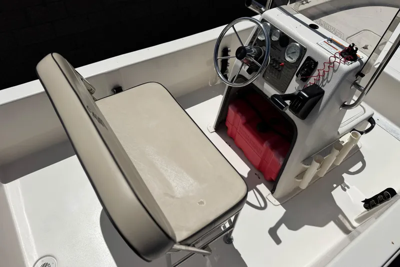 Slide: The Image of 2024 Carolina Skiff E18 JVX CC boat interior with steering console and seating. - 21