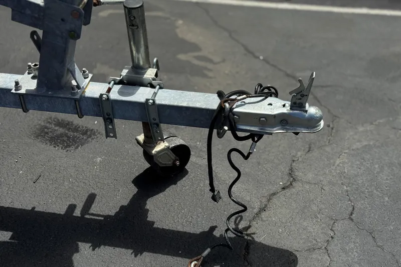 Slide: The Image of Trailer hitch of a 2024 Carolina Skiff E18 JVX CC on asphalt pavement. - 24
