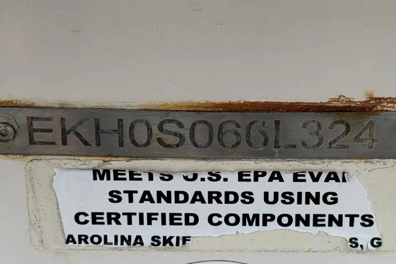 Slide: The Image of 2024 Carolina Skiff E18 JVX CC hull identification number and EPA compliance label. - 26