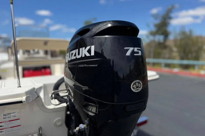 Slide: The Image of 2024 Carolina Skiff E18 JVX CC with Suzuki 75 horsepower outboard motor. - 7