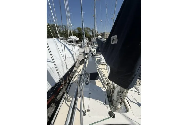 Slide: The Image of Sailboat deck view of 2002 Saga 43, docked with other boats. - 16