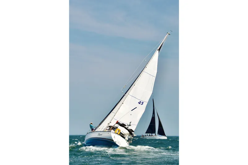 Slide: The Image of Sailing yacht Saga 43 from 2002 navigating ocean waters under clear skies. - 3