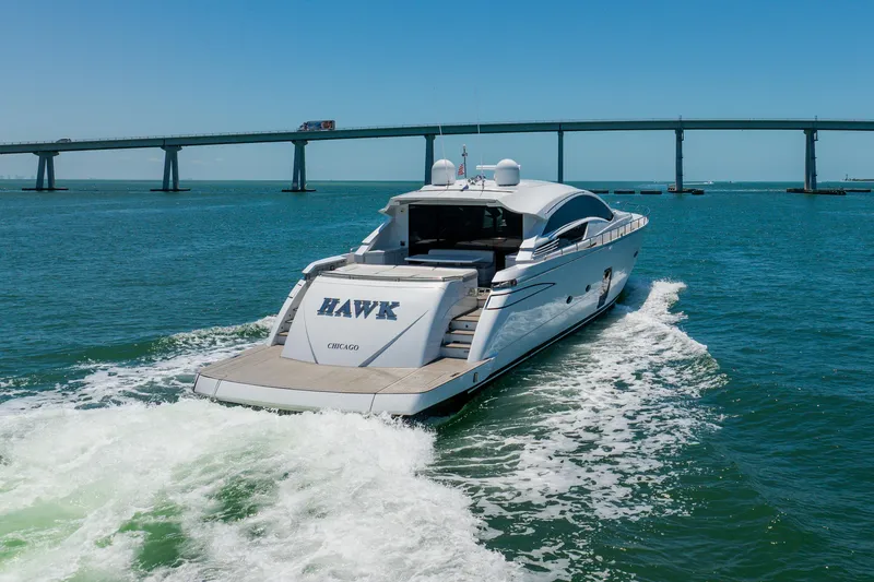 Slide: The Image of Luxury Pershing 80 yacht cruising under a bridge, 2010 model, on open water. - 10
