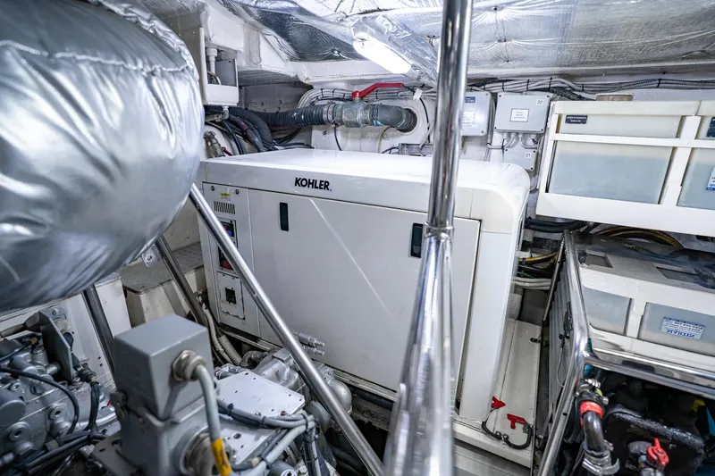 Slide: The Image of Engine room of 2010 Pershing 80 yacht featuring Kohler generator. - 105