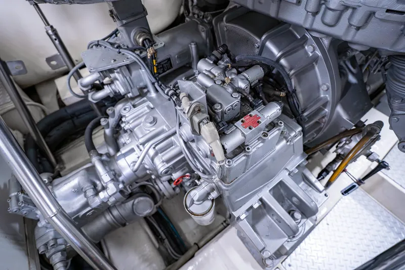 Slide: The Image of Engine compartment of a 2010 Pershing 80 yacht, showcasing mechanical components. - 106