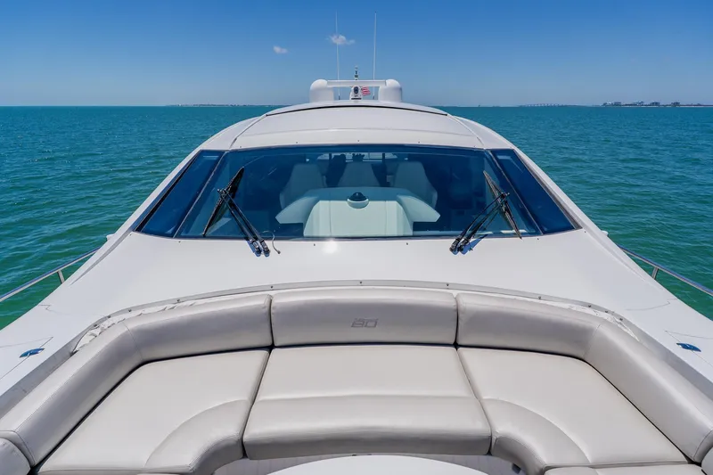 Slide: The Image of Luxury 2010 Pershing 80 yacht on open sea, featuring sleek design and spacious deck. - 110