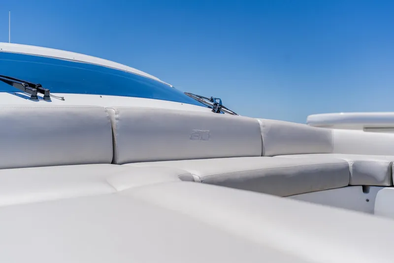 Slide: The Image of Luxury seating on a 2010 Pershing 80 yacht under clear blue skies. - 111