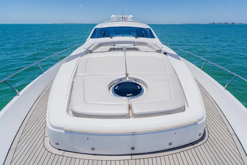 Slide: The Image of Luxurious 2010 Pershing 80 yacht deck with sunbathing area on open sea. - 112