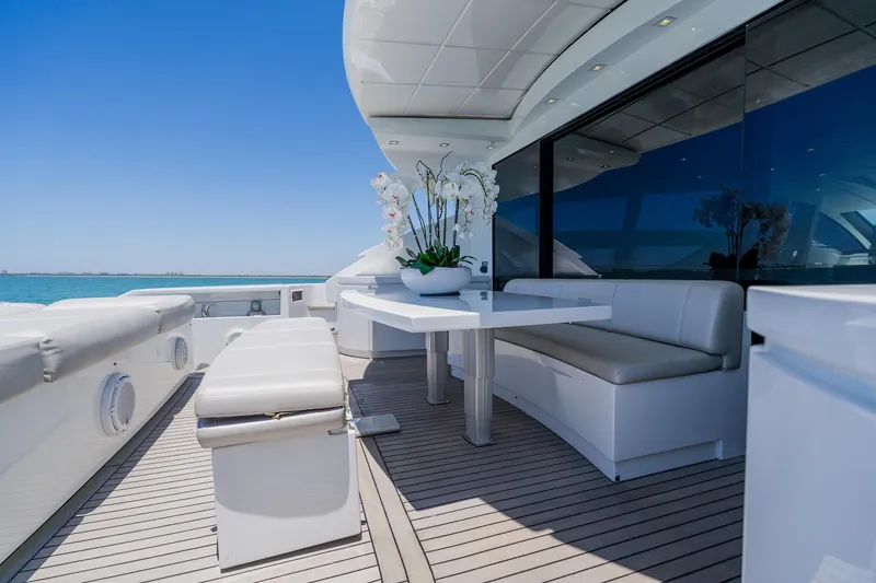 Slide: The Image of Luxurious 2010 Pershing 80 yacht deck with elegant seating and ocean view. - 119