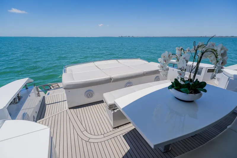 Slide: The Image of Luxurious 2010 Pershing 80 yacht deck with elegant seating and ocean view. - 123
