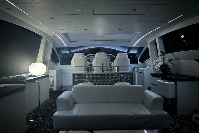 Slide: The Image of Luxurious interior of a 2010 Pershing 80 yacht with modern seating and ambient lighting. - 128