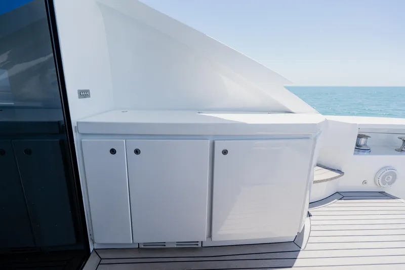 Slide: The Image of Luxurious 2010 Pershing 80 yacht deck with sleek cabinetry and ocean view. - 19