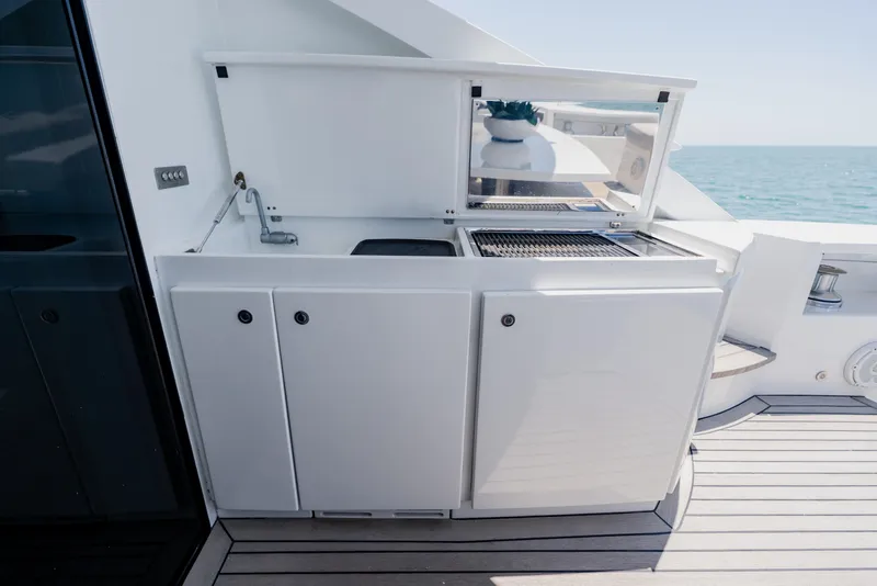 Slide: The Image of Outdoor kitchen on 2010 Pershing 80 yacht with grill and sink, ocean view. - 20