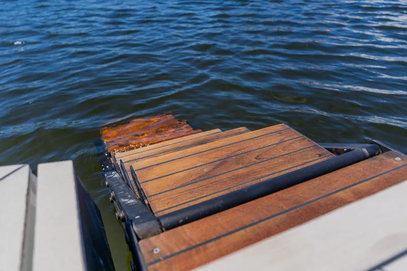 Slide: The Image of Wooden boat ladder descending into water, Pershing 80 yacht, 2010 model. - 27