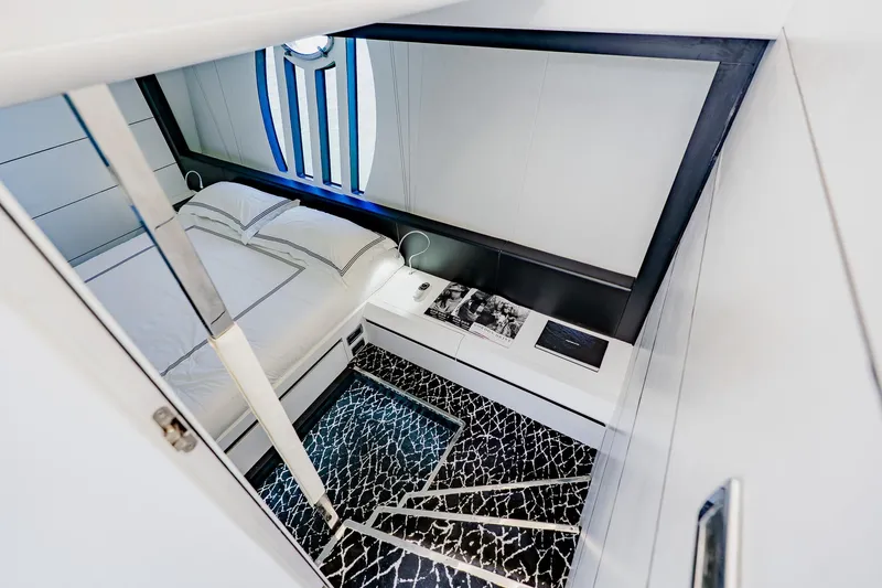 Slide: The Image of Luxurious bedroom interior of 2010 Pershing 80 yacht with modern design and elegant decor. - 29
