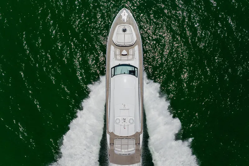 Slide: The Image of Aerial view of 2010 Pershing 80 yacht cruising on green water. - 3