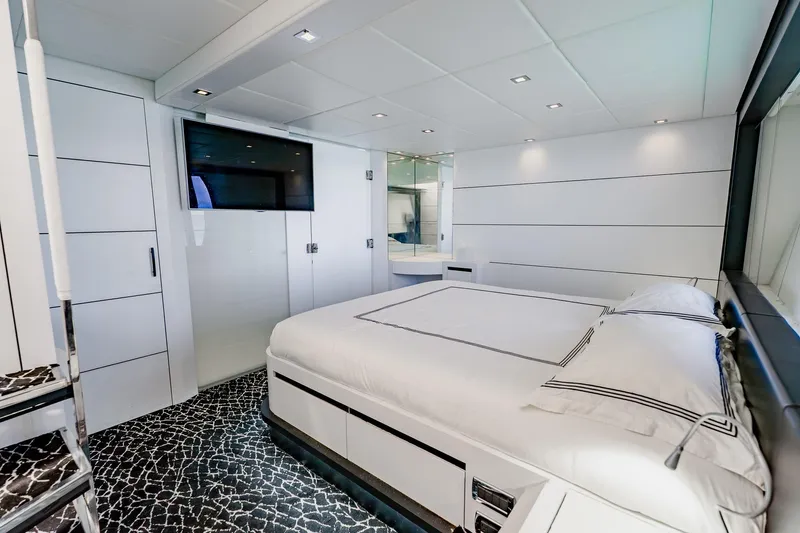 Slide: The Image of Luxurious bedroom interior on a 2010 Pershing 80 yacht, featuring modern design and elegant decor. - 31