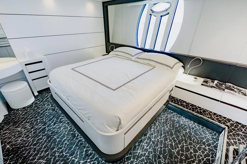 Slide: The Image of Luxurious bedroom interior on a 2010 Pershing 80 yacht, featuring modern design and elegant decor. - 32