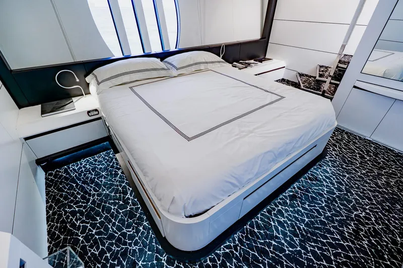 Slide: The Image of Luxurious bedroom interior on a 2010 Pershing 80 yacht with modern design elements. - 33
