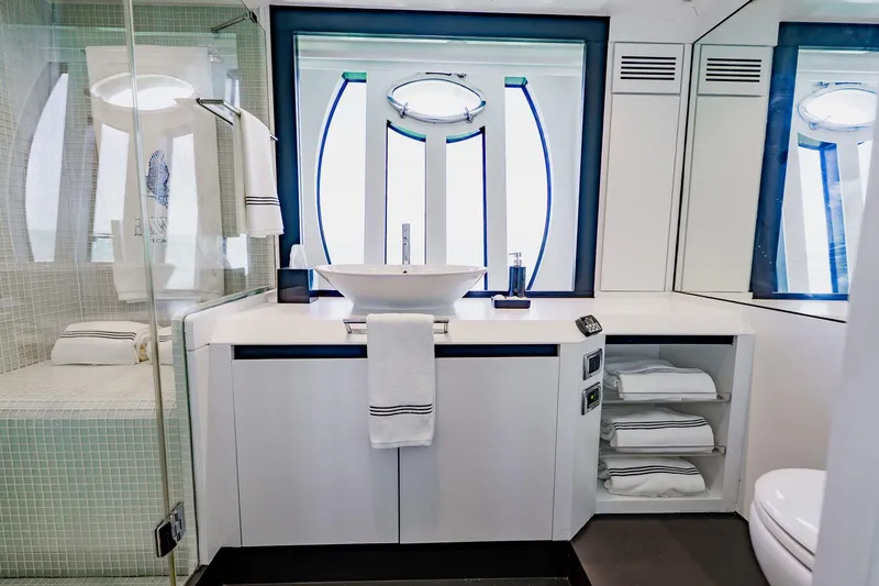 Slide: The Image of Luxurious bathroom interior on a 2010 Pershing 80 yacht, featuring modern fixtures and elegant design. - 37