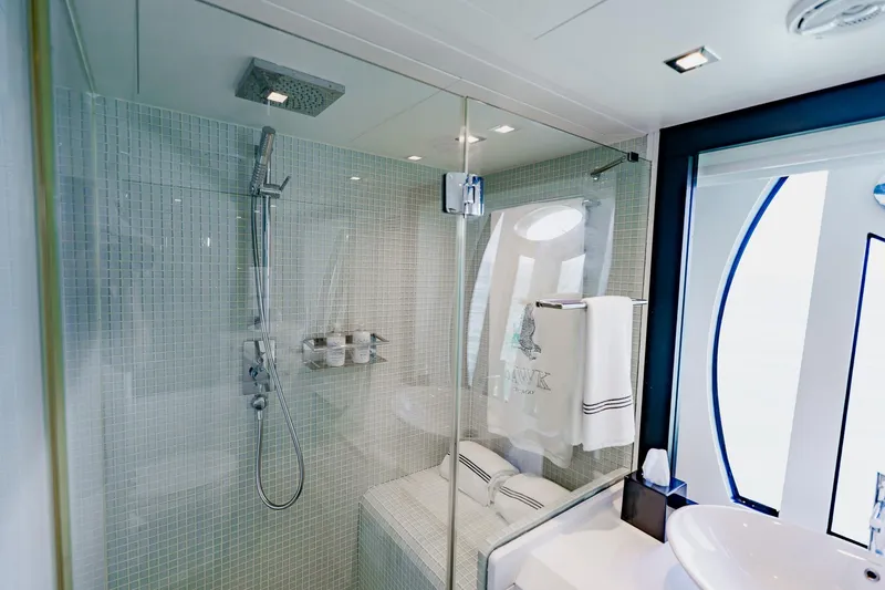 Slide: The Image of Luxurious bathroom with glass shower in 2010 Pershing 80 yacht, featuring modern fixtures and elegant design. - 39