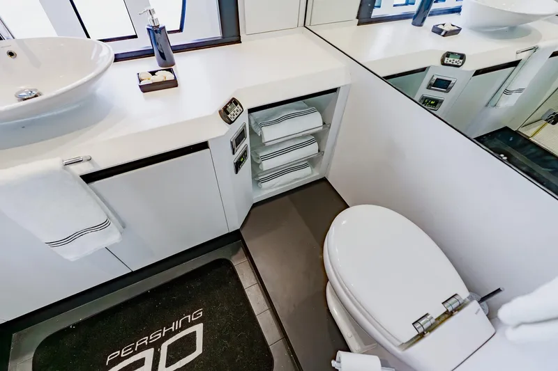 Slide: The Image of Luxurious bathroom interior of a 2010 Pershing 80 yacht, featuring modern fixtures and sleek design. - 40