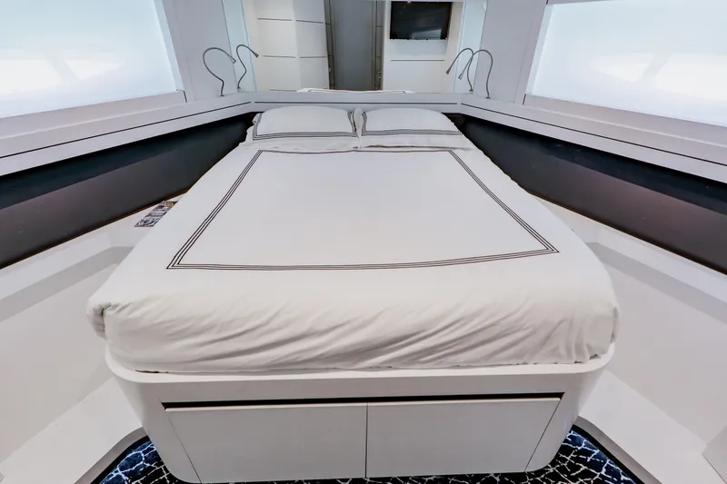 Slide: The Image of Luxurious bedroom interior on a 2010 Pershing 80 yacht, featuring a neatly made bed. - 41
