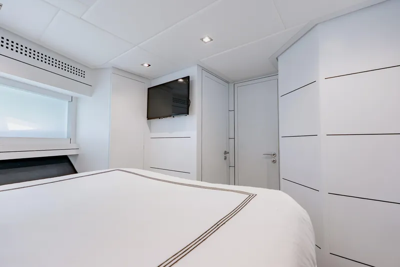 Slide: The Image of Luxurious interior cabin of a 2010 Pershing 80 yacht with modern design elements. - 43